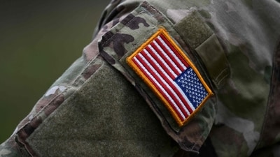 A soldier of the US army wears the country's flag on his uniform. (AFP)