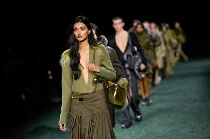 A model wears a creation for the Burberry Winter 2024 fashion show. (Photo by Scott A Garfitt/Invision/AP) A model wears a creation for the Burberry Winter 2024 fashion show. (Photo by Scott A Garfitt/Invision/AP)