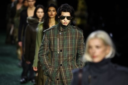 Models present creations during a catwalk presentation for British fashion house Burberry's Autumn/Winter 2024 collection, at London Fashion Week. (Photo by HENRY NICHOLLS / AFP) Models present creations during a catwalk presentation for British fashion house Burberry's Autumn/Winter 2024 collection, at London Fashion Week. (Photo by HENRY NICHOLLS / AFP)