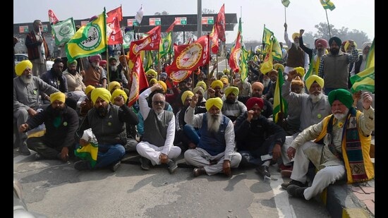 On Tuesday, farmers belonging to SKM and Kirti Kisan Union from across the state, joined the protesters at Ladhowal toll plaza. (HT Photo)