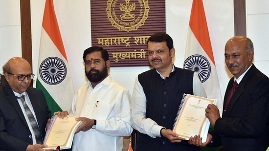 Chairman of the State Backward Classes Commission, retired Justice Sunil Shukre, hands over the survey report on the backwardness of the Maratha community to Maharashtra Chief Minister Eknath Shinde, in Mumbai on Friday. Deputy CM Devendra Fadanvis is also present. (Eknath Shinde-X)