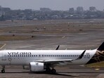 A Vistara passenger aircraft taxis on the tarmac at Chhatrapati Shivaji International Airport in Mumbai, India. A Vistara passenger aircraft taxis on the tarmac at Chhatrapati Shivaji International Airport in Mumbai, India.