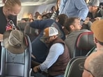 A disruptive passenger on an American Airlines flight was subdued and tackled to the floor when he attempted, and briefly succeeded, in opening the aircraft's emergency door, as captured in a video. A disruptive passenger on an American Airlines flight was subdued and tackled to the floor when he attempted, and briefly succeeded, in opening the aircraft's emergency door, as captured in a video.