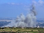 Smoke billows from the site of an Israeli airstrike on the villages of Mansouri and Majdelzoun near Lebanon's southern border.