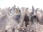 Afghan volunteers clean up rubble after an earthquake in Zenda Jan district in Herat province, western Afghanistan Afghan volunteers clean up rubble after an earthquake in Zenda Jan district in Herat province, western Afghanistan