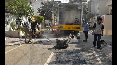 According to Ludhiana MC officials, the machines can fix about 10 potholes a day using a process called the in-situ tarmac recycling system. (HT Photo)