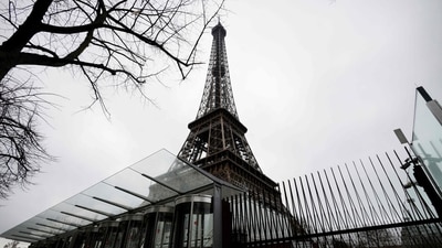 This photograph shows the closed Eiffel Tower during a strike of the Eiffel Tower's staff, over the financial management of the monument by the city, closing the monument to the public during the second week of the French school holidays, in Paris. Eiffel Tower closed again amid staff strike, ticket holders to be reimbursed (Photo by GEOFFROY VAN DER HASSELT / AFP) This photograph shows the closed Eiffel Tower during a strike of the Eiffel Tower's staff, over the financial management of the monument by the city, closing the monument to the public during the second week of the French school holidays, in Paris. Eiffel Tower closed again amid staff strike, ticket holders to be reimbursed (Photo by GEOFFROY VAN DER HASSELT / AFP)
