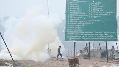 Haryana Police fire tear-gas shells at Shambhu on the border with Punjab to prevent protesting farmers from marching to Delhi on Wednesday. (Ravi Kumar/HT) Haryana Police fire tear-gas shells at Shambhu on the border with Punjab to prevent protesting farmers from marching to Delhi on Wednesday. (Ravi Kumar/HT)