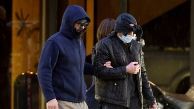 Former FBI informant Alexander Smirnov, left, walks out of his lawyer's office in downtown Las Vegas after being released from federal custody Tuesday, Feb. 20, 2024. (AP)