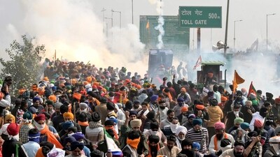 Police fire teargas to disperse farmers marching towards New Delhi during a protest demanding minimum crop prices, at the Haryana-Punjab state border in Shambhu at Patiala. (AFP) Police fire teargas to disperse farmers marching towards New Delhi during a protest demanding minimum crop prices, at the Haryana-Punjab state border in Shambhu at Patiala. (AFP)