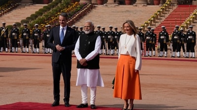 Greece's Prime Minister Kyriakos Mitsotakis, left, and his wife Maria Eva Virginia Grabowski, right, pose for a photograph with Indian Prime Minister Narendra Modi (AP) Greece's Prime Minister Kyriakos Mitsotakis, left, and his wife Maria Eva Virginia Grabowski, right, pose for a photograph with Indian Prime Minister Narendra Modi (AP)
