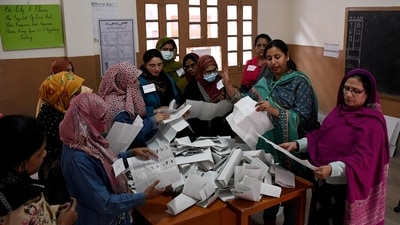 Polling staff count ballots after the end of the voting at a polling station during a general election, in Hyderabad, Pakistan. (Reuters)