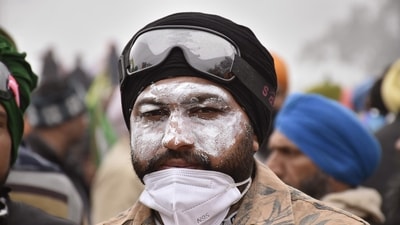 A protestor during the farmers' 'Delhi Chalo' march, near the Punjab-Haryana Shambhu Border in Patiala district on Wednesday, (PTI) A protestor during the farmers' 'Delhi Chalo' march, near the Punjab-Haryana Shambhu Border in Patiala district on Wednesday, (PTI)