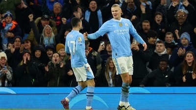 Manchester City's Erling Braut Haaland celebrates scoring their first goal with Phil Foden (REUTERS)