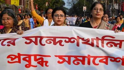 Women hold banner during a protest march in Kolkata in Sandeshkhali case (PTI Photo) Women hold banner during a protest march in Kolkata in Sandeshkhali case (PTI Photo)