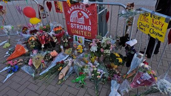 A person views a memorial dedicated to the victims of last week's mass shooting in front of Union Station, Sunday, Feb. 18, 2024, in Kansas City, Mo (AP Photo/Charlie Riedel, File) (AP)
