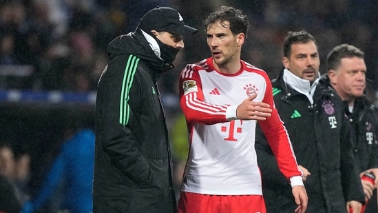 Bayern's Leon Goretzka talks with Bayern's head coach Thomas Tuchel (AP)