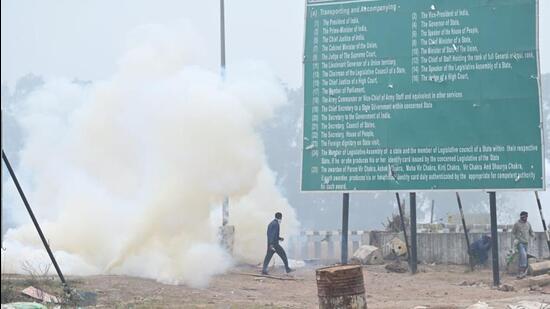 Haryana Police fire tear-gas shells at Shambhu on the border with Punjab to prevent protesting farmers from marching to Delhi on Wednesday. (Ravi Kumar/HT)