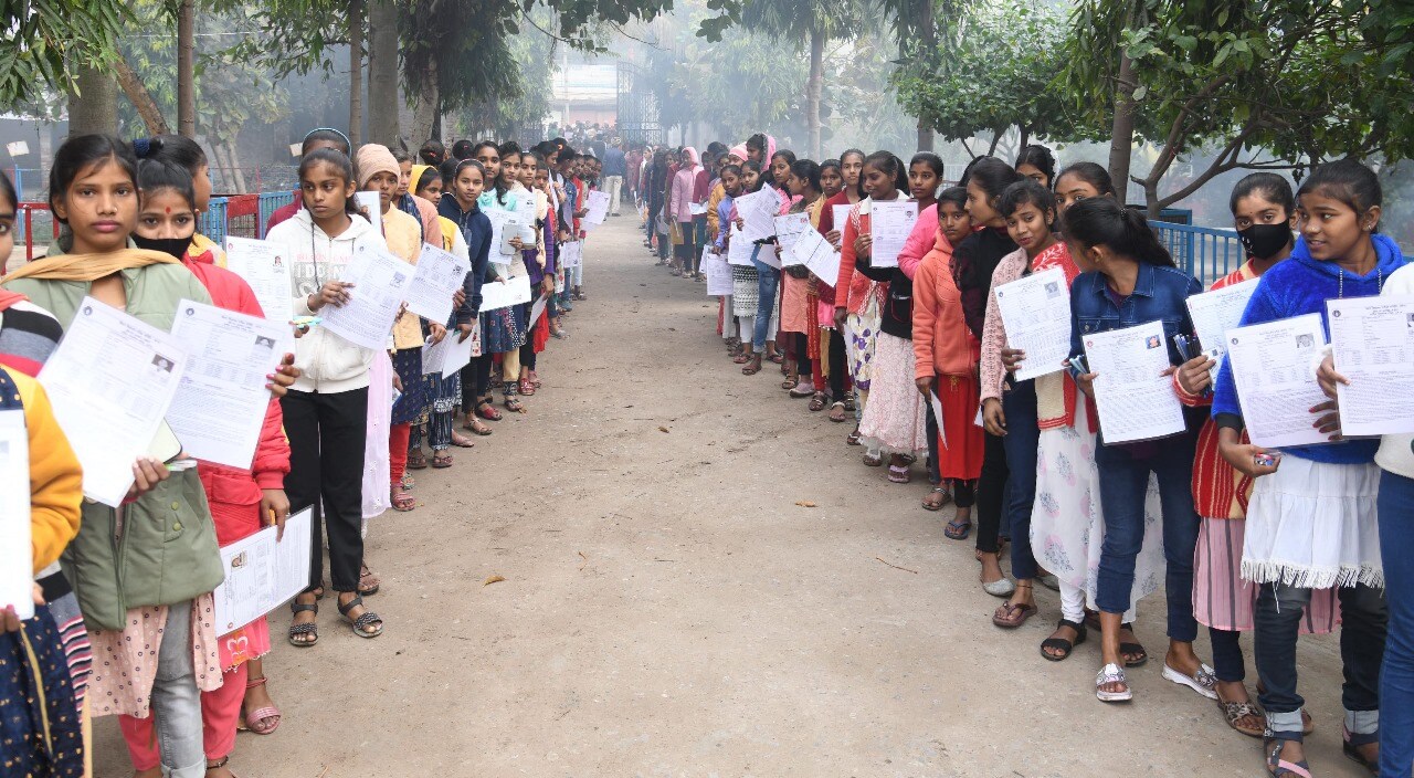 Students standing in queue to appear in the Bihar Board class 10th examination at DAV High School Danapur in Patna 
Photo by Santosh Kumar