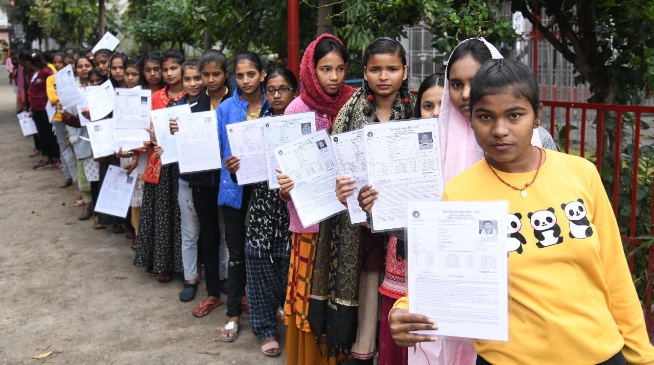 Students standing in a queue with their hall tickets at DAV High School Danapur in Patna 
Photo by Santosh Kumar