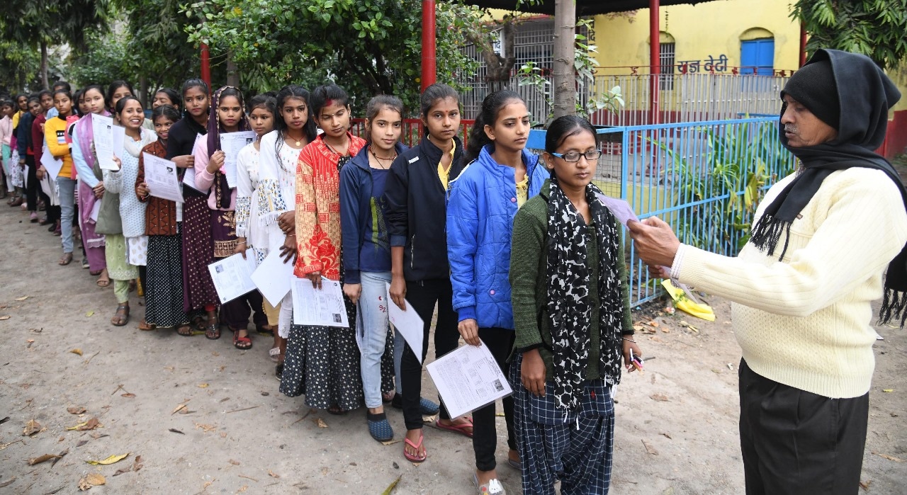 Students standing in queue to appear in the Bihar Board class 10th examination at DAV High School Danapur in Patna 
Photo by Santosh Kumar