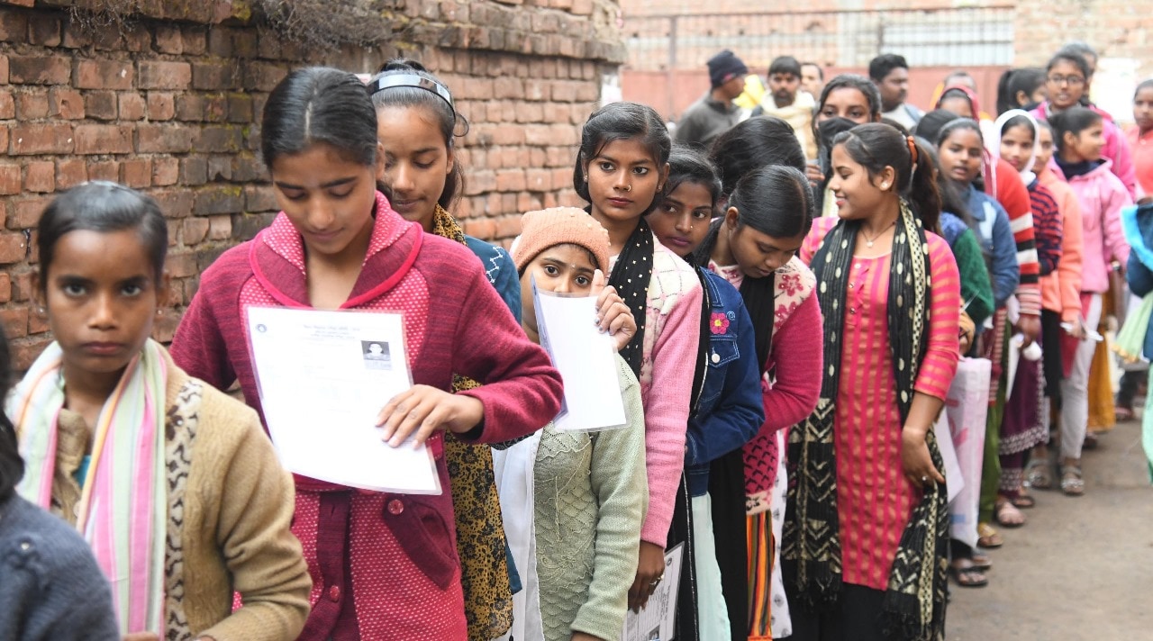 Students standing in queue to appear in the Bihar Board class 10th examination at D.D. Nandan Kanya High School Danapur in Patna 
Photo by Santosh Kumar