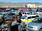 Afghan men leaving a football stadium after attending the public execution by Taliban authorities of two men convicted of murder, in Ghazni. Afghan men leaving a football stadium after attending the public execution by Taliban authorities of two men convicted of murder, in Ghazni.