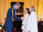 Emilia Clark and her mother Jennifer, Co-Founders and Trustees, SameYou, are made Members of the Order of the British Empire by Britain's Prince William, Prince of Wales at Windsor Castle, in Windsor, England.