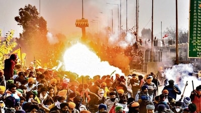 A tear gas shell fired by police explodes near the Shambhu border on Wednesday. (PTI)