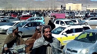 Afghan men leaving a football stadium after attending the public execution by Taliban authorities of two men convicted of murder, in Ghazni. (AFP) Afghan men leaving a football stadium after attending the public execution by Taliban authorities of two men convicted of murder, in Ghazni. (AFP)