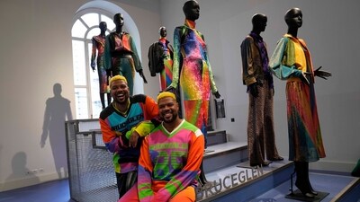 From left, designers Glen and Bruce Proctor pose for portraits in front of their creations at the fashion hub part of the women's Fall-Winter 2024-25 collection presented in Milan, northern Italy. (AP Photo/Antonio Calanni) From left, designers Glen and Bruce Proctor pose for portraits in front of their creations at the fashion hub part of the women's Fall-Winter 2024-25 collection presented in Milan, northern Italy. (AP Photo/Antonio Calanni)