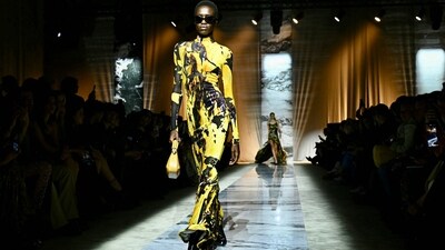 A model presented the Roberto Cavalli collection in a stunning abstract printed yellow maxi length dress, bringing a splash of colour and brightness to Milan Fashion Week Autumn/Winter Womenswear. (AFP) A model presented the Roberto Cavalli collection in a stunning abstract printed yellow maxi length dress, bringing a splash of colour and brightness to Milan Fashion Week Autumn/Winter Womenswear. (AFP)
