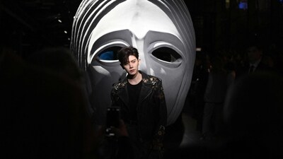 Popular Chinese artist Ren Jialun graced the Etro show at Milan Fashion Week. He looks chic in an all-black ensemble consisting of a T-shirt paired with a trendy leather jacket embellished with gold floral embroidery, back pants and matching sneakers. (Photo by Marco BERTORELLO / AFP) Popular Chinese artist Ren Jialun graced the Etro show at Milan Fashion Week. He looks chic in an all-black ensemble consisting of a T-shirt paired with a trendy leather jacket embellished with gold floral embroidery, back pants and matching sneakers. (Photo by Marco BERTORELLO / AFP)