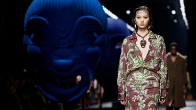 A model presents a creation from the Etro Autumn/Winter 2024/2025 collection during Milan Fashion Week. Her outfit was all about flowers and reflected spring fashion. The oversized sleeves, flowing silhouette and intriguing green and white floral print adorning the brown dress is simply stunning. The statement necklace and earrings are the perfect finishing touch. (REUTERS)