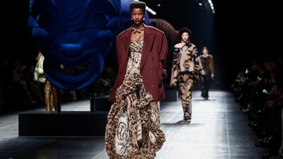 One model stunned on the ramp in a stunning printed dress adorned all over with a trendy abstract print. The uneven hemline was embellished with ruffles to add to the wow factor. Paired with an oversized blouse, this look from Etro's Autumn/Winter 2024/2025 collection stole the limelight at Milan Fashion Week. (REUTERS/Alessandro Garofalo)