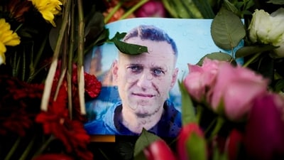 Rain drops cover a portrait of Russian opposition leader Alexei Navalny. (AP) Rain drops cover a portrait of Russian opposition leader Alexei Navalny. (AP)
