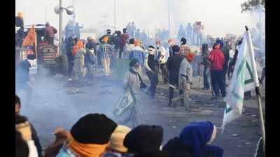 Police fire tear gas to disperse protesting farmers at Shambhu border on Wednesday. (PTI) Police fire tear gas to disperse protesting farmers at Shambhu border on Wednesday. (PTI)