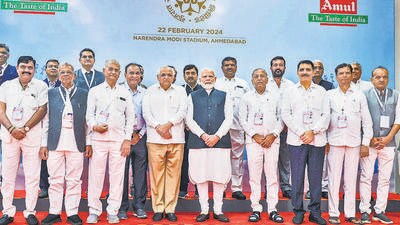 Prime Minister Narendra Modi with Gujarat Chief Minister Bhupendra Patel, Gujarat Cooperative Milk Marketing Federation (GCMMF) Chairman Shamalbhai Patel and others at an exhibition by Amul during the golden jubilee celebration of GCMMF in Ahmedabad on Thursday. (PTI)