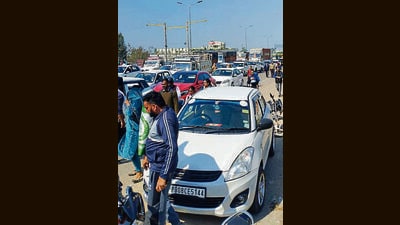 Protesters blocking a national highway near Phillaur on Thursday. (HT Photo)