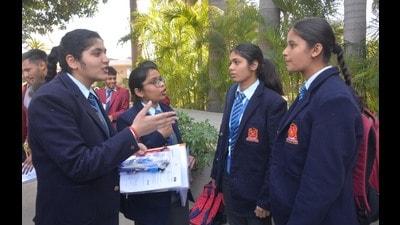 Students discussing the English question paper after the exam on Thursday. (Sant Arora/HT) Students discussing the English question paper after the exam on Thursday. (Sant Arora/HT)
