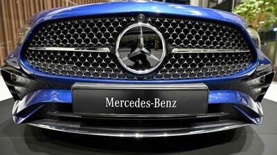 The Mercedes-Benz logo is displayed on the front of a Mercedes-Benz CLE Cabriolet passenger car at the Annual Results Conference of the Mercedes-Benz Group AG in Stuttgart, southern Germany (AFP)