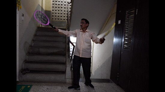 Mumbai, India. Feb 21,2024 - A resident of Pratiksha Nagar, Sion uses an electric bat to kill mosquitoes and protect himself. There have been mosquitoes in the area for the past few months. Feb 21,2024. (Photo by Raju Shinde/HT Photo)