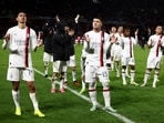 AC Milan players applaud fans.