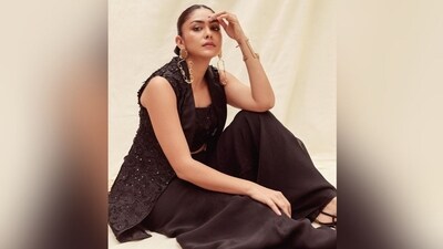 On Thursday, Mrunal gave her fans a sweet surprise as the actress took to Instagram and uploaded a series of glam pictures accompanied by the caption "May your delulu become trululu". In the post, the actress can be seen looking all radiant in a black palazzo set and striking sassy poses. (Instagram/@mrunalthakur) On Thursday, Mrunal gave her fans a sweet surprise as the actress took to Instagram and uploaded a series of glam pictures accompanied by the caption "May your delulu become trululu". In the post, the actress can be seen looking all radiant in a black palazzo set and striking sassy poses. (Instagram/@mrunalthakur)