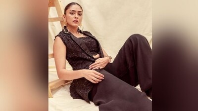 Assisted by celebrity fashion stylist Tanishq Malhotra, Mrunal accessorised her chic look with a pair of oversized golden statement earrings, a quirky bracelet adorning her wrist and a pair of abstract printed belly shoes. (Instagram/@mrunalthakur) Assisted by celebrity fashion stylist Tanishq Malhotra, Mrunal accessorised her chic look with a pair of oversized golden statement earrings, a quirky bracelet adorning her wrist and a pair of abstract printed belly shoes. (Instagram/@mrunalthakur)
