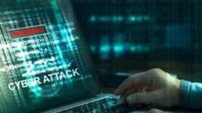 Computer hacker. Internet crime working on a code on laptop screen with dark digital background. Cyber attack in cyberspace concept (Getty Images/iStockphoto) Computer hacker. Internet crime working on a code on laptop screen with dark digital background. Cyber attack in cyberspace concept (Getty Images/iStockphoto)