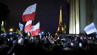 Protesters hold flags with the Eiffel Tower in the background, during a demonstration organised by the association "Russie-Libertes" following the death in an arctic prison of the opposition leader Alexei Navalny, at the Esplanade du Trocadero in Paris. (AFP) Protesters hold flags with the Eiffel Tower in the background, during a demonstration organised by the association "Russie-Libertes" following the death in an arctic prison of the opposition leader Alexei Navalny, at the Esplanade du Trocadero in Paris. (AFP)