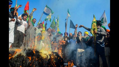Farmers burn effigies during the 'Black Day' protest at the Punjab-Haryana Shambhu border, in Patiala district, Friday. (PTI) Farmers burn effigies during the 'Black Day' protest at the Punjab-Haryana Shambhu border, in Patiala district, Friday. (PTI)