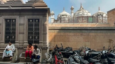 People rest on the stairs of a temple adjacent to the Gyanvapi mosque in the holy city of Varanasi on February 16, 2024. (AFP) People rest on the stairs of a temple adjacent to the Gyanvapi mosque in the holy city of Varanasi on February 16, 2024. (AFP)
