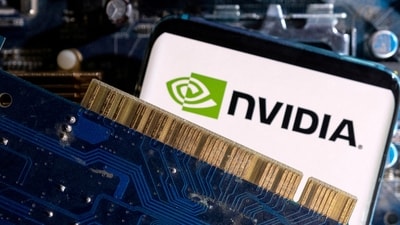 A smartphone with a displayed NVIDIA logo is placed on a computer motherboard. (Reuters)
